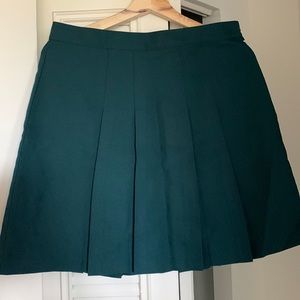 Green pleated skirt